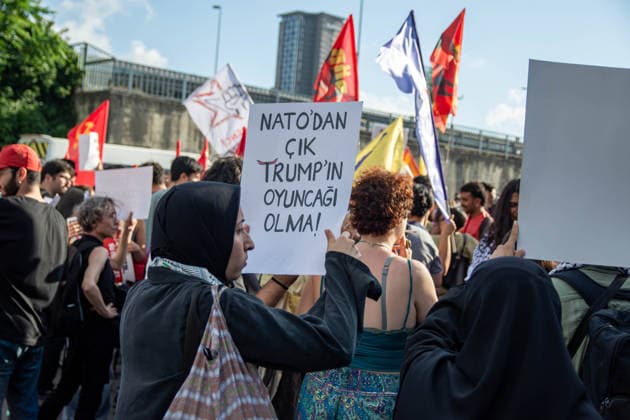 June 27, 2026, Istanbul, Istanbul, Turkey: Activists from the No to NATO! Coordination staged a protest in front of Trump Towers in Istanbul, Turkey, carrying a banner reading Imperialist war organization NATO and Trump, you are not welcome! The demonstration opposed the upcoming NATO Summit scheduled to take place in Ankara on July 7Ã¢â‚¬8. Istanbul Turkey - ZUMAt171 20260627_zip_t171_025 Copyright: xAbdullahxTepelix