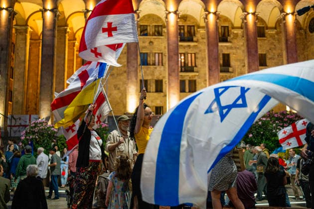 June 27, 2026, Tbilisi, Georgia: Protesters holding Georgian, Israel and Ukraine flags participate on the 577th day of anti-government rallies in Tbilisi, Georgia. Tbilisi Georgia  - ZUMAz174 20260627_zip_z174_007 Copyright: xMoexZoyarix