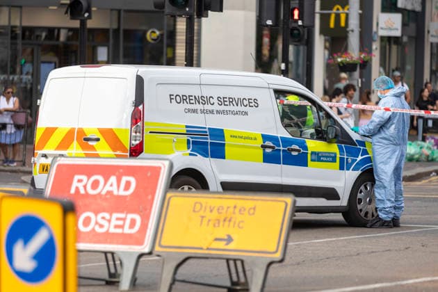 June 27, 2026, London, London, UK: London, UK. A police forensic officer gathers evidence as emergency services are at the scene in Ealing Broadway, west London, after a car struck pedestrians outside Marks & Spencer. London UK  - ZUMAl94_ 20260627_zaf_l94_025 Copyright: xMarcinxNowakx