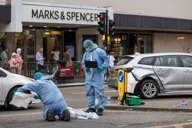 June 27, 2026, London, London, UK: London, UK. Police forensic officers gather evidence at the scene in Ealing Broadway, west London, after a car struck pedestrians outside Marks & Spencer. London UK  - ZUMAl94_ 20260627_zaf_l94_041 Copyright: xMarcinxNowakx