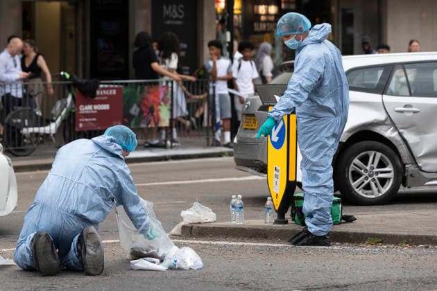 June 27, 2026, London, London, UK: London, UK. Police forensic officers gather evidence at the scene in Ealing Broadway, west London, after a car struck pedestrians outside Marks & Spencer. London UK  - ZUMAl94_ 20260627_zaf_l94_042 Copyright: xMarcinxNowakx