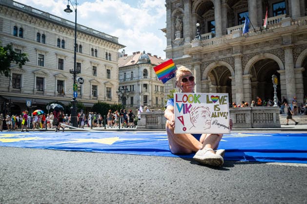 June 27, 2026, Budapest, Budapest, Hungary: A participant is sitting in front of the Budapest Opera house where the crowd gathered for the 31st Budapest Pride march on 27 June, 2026. Budapest Hungary  - ZUMAa256 20260627_zip_a256_001 Copyright: xDanielxAlfoldix