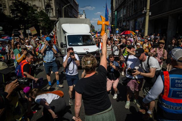 June 27, 2026, Budapest, Budapest, Hungary: A counter-protester holds up a holy cross as she is trying to halt the march during the 31st Budapest Pride on 27 June, 2026. Budapest Hungary  - ZUMAa256 20260627_zip_a256_007 Copyright: xDanielxAlfoldix
