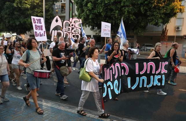 Protest against government in Tel Aviv TEL AVIV, ISRAEL - JUNE 27: People stage a protest against Prime Minister Benjamin Netanyahu and the current government as they gather in Habima Square in Tel Aviv, Israel on June 27, 2026. Protestors, calling on Israel to end its attacks on Gaza and Lebanon, carried placards criticizing the government’s war policies and the compulsory military service imposed on Ultra-Orthodox (Haredi) Jews. Gideon Markowicz Anadolu Tel Aviv Israel. Editorial use only. Please get in touch for any other usage.  Copyright: x2026xAnadoluxGideonxMarkowiczx