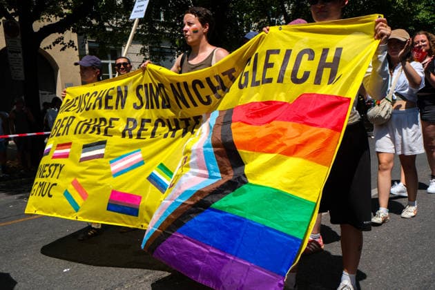 June 27, 2026, Munich, Bayern, Germany: People march through Munich s streets under the banner Our diversity. Our strength to advocate for LGBTQIA+ rights, despite high temperatures. Munich Germany  - ZUMAm309 20260627_zip_m309_035 Copyright: xJuliusxMortsix
