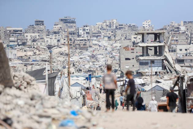 Jabalia Gaza Daily Life Palestinian children walk past rubble and destroyed buildings in Jabalia, northern Gaza Strip on June 27, 2026. Residents remain among the ruins of damaged and destroyed buildings in Jabalia, where access to basic services such as water, electricity, and shelter remains severely limited. Gaza Gaza Strip Palestinian Territories Copyright: xAhmedxAlxArinix
