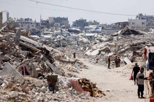 Jabalia Gaza Daily Life Palestinian residents walk along a rubble-strewn path between makeshift shelters and destroyed buildings in Jabalia, northern Gaza Strip on June 27, 2026. Residents remain among the ruins of damaged and destroyed buildings in Jabalia, where access to basic services such as water, electricity, and shelter remains severely limited. Gaza Gaza Strip Palestinian Territories Copyright: xAhmedxAlxArinix