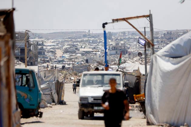 Jabalia Gaza Daily Life A vehicle moves along a road between makeshift shelters and damaged buildings in Jabalia, northern Gaza Strip on June 27, 2026. Residents remain among the ruins of damaged and destroyed buildings in Jabalia, where access to basic services such as water, electricity, and shelter remains severely limited. Gaza Gaza Strip Palestinian Territories Copyright: xAhmedxAlxArinix