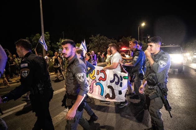 Anti-government protest held in West Jerusalem WEST JERUSALEM - JUNE 27: Dozens of Israelis gather to protest against Prime Minister Benjamin Netanyahu and the current government, calling for their resignation and early elections, in West Jerusalem on June 27, 2026. Demonstrators carry placards criticizing Israeli military operations and settlement policies, chant slogans against Netanyahu, and express opposition to what they describe as genocide in Gaza. Mostafa Alkharouf Anadolu Jerusalem Israel. Editorial use only. Please get in touch for any other usage.  Copyright: x2026xAnadoluxMostafaxAlkharoufx