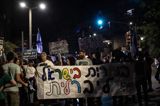 Anti-government protest held in West Jerusalem WEST JERUSALEM - JUNE 27: Dozens of Israelis gather to protest against Prime Minister Benjamin Netanyahu and the current government, calling for their resignation and early elections, in West Jerusalem on June 27, 2026. Demonstrators carry placards criticizing Israeli military operations and settlement policies, chant slogans against Netanyahu, and express opposition to what they describe as genocide in Gaza. Mostafa Alkharouf Anadolu Jerusalem Israel. Editorial use only. Please get in touch for any other usage.  Copyright: x2026xAnadoluxMostafaxAlkharoufx