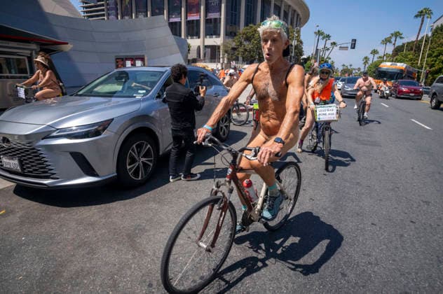 June 27, 2026, Los Angeles, California, United States: (EDITORS NOTE: Image contains nudity) .Nude cyclists ride past Walt Disney Concert Hall in Downtown Lo Angeles in the World Naked Bike Ride. Los Angeles United States - ZUMAs197 20260627_aaa_s197_066 Copyright: xRingoxChiux