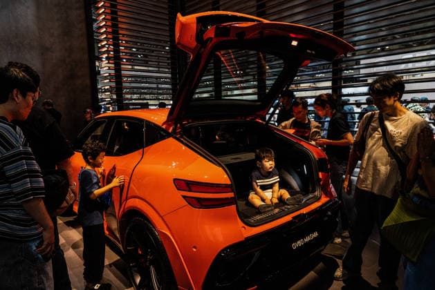 June 27, 2026, Busan, South Korea: People take photos and experience a test drive of the Genesis GV60 Magma during the Busan International Mobility Show 2026 (BIMOS 2026) at BEXCO. Busan International Mobility Show 2026 (BIMOS 2026) is happening from June 26 to July 5. Busan South Korea - ZUMAs197 20260627_aaa_s197_118 Copyright: xSimonxShinx