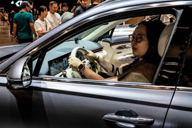 June 27, 2026, Busan, South Korea: A woman experiences the Electrified GV70 during the Busan International Mobility Show 2026 (BIMOS 2026) at BEXCO. Busan International Mobility Show 2026 (BIMOS 2026) is happening from June 26 to July 5. Busan South Korea - ZUMAs197 20260627_aaa_s197_126 Copyright: xSimonxShinx
