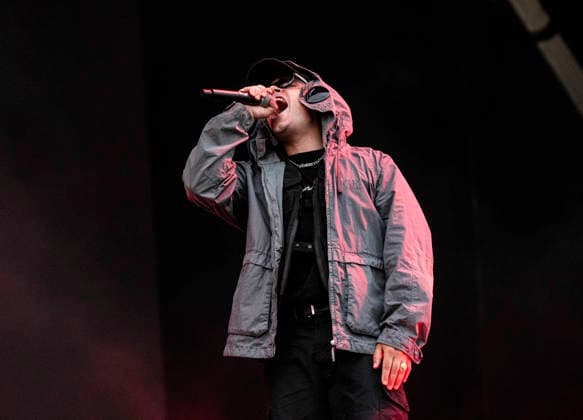 Kneecap performing live at Crystal Palace Park, London 27 June 2026 Kneecap performing live at Crystal Palace Park, London 27 June 2026 Moglai Bap (Naoise O Caireallai) - rapper, vocals Kneecap are an Irish hip-hop trio. They rap in a mixture of English and Irish. Their first single C.E.A.R.T.A. (cearta is Irish for rights ) was released in ˜17, followed by their mixtape, 3CAG, in ˜18. Their first studio album, Fine Art, was released in ˜24 Their second studio album, Fenian, was released in ˜26. The group has been at the centre of public debates about free speech and the expression of political opinions within Ireland and the UK. Their themes focus on working class, youth culture, Irish republicanism and Irish language rights  Copyright: xDafyddxOwenx xDafyddxOwenx-xB5377x xAvalonx 1112995617
