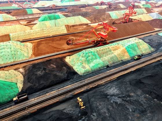 Qingdao Port Ore Terminal Construction machinery is sorting and loading imported iron ore at the Qingdao Port Ore Terminal in Qingdao, Shandong Province, China on June 28, 2026. Qingdao Shandong China  Copyright: xCFOTOx i1782655941898