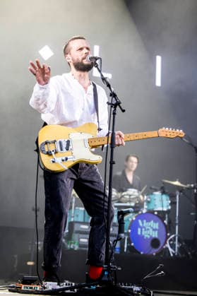 White Lies live at Tinderbox 2026 Odense, Denmark. 27th, June 2026. The English indie rock and post-punk band White Lies performs a live concert during the Danish music festival Tinderbox 2026 in Odense. Here singer and guitarist Harry McVeigh is seen live on stage. Denmark, Odense  Copyright: xGonzalesxPhoto LassexLagonix