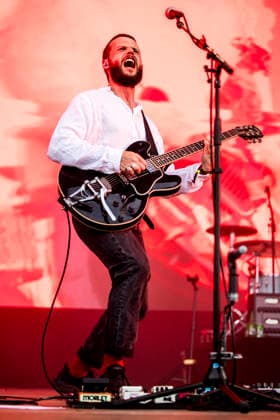 White Lies live at Tinderbox 2026 Odense, Denmark. 27th, June 2026. The English indie rock and post-punk band White Lies performs a live concert during the Danish music festival Tinderbox 2026 in Odense. Here singer and guitarist Harry McVeigh is seen live on stage. Denmark, Odense  Copyright: xGonzalesxPhoto LassexLagonix