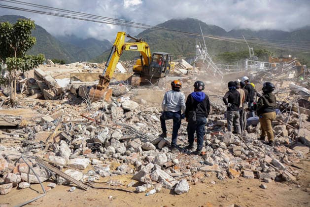 Members of Caracas firefighters search for victims amid debris of a demolished building after a magnitude 7.2 earthquake struck Venezuela and other regions in the Caribbean in La Guaira, Venezuela, on June 27, 2026. According to the U.S. Geological Survey, a powerful 7.5?magnitude aftershock struck after the main quake. Medical and media sources reported that the death toll has risen to around 1,500, with some 3,000 others injured. A web page created to track the missing has listed nearly 50,000 people as unaccounted for. photo by Jonathan Lanza  VAN2026062801 JonathanxLanza