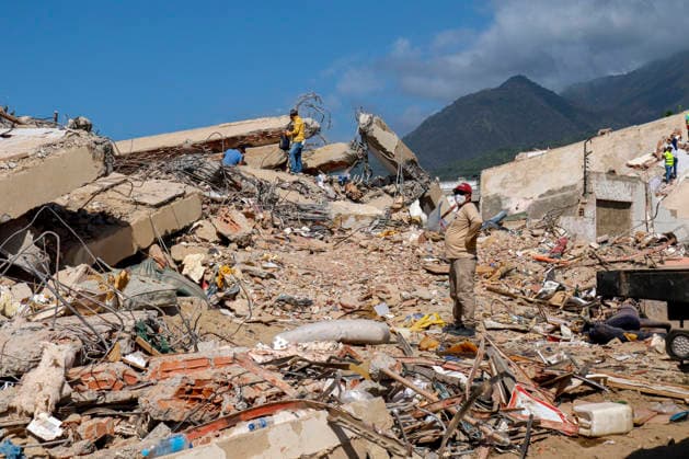 Members of Caracas firefighters search for victims amid debris of a demolished building after a magnitude 7.2 earthquake struck Venezuela and other regions in the Caribbean in La Guaira, Venezuela, on June 27, 2026. According to the U.S. Geological Survey, a powerful 7.5?magnitude aftershock struck after the main quake. Medical and media sources reported that the death toll has risen to around 1,500, with some 3,000 others injured. A web page created to track the missing has listed nearly 50,000 people as unaccounted for. photo by Jonathan Lanza  VAN2026062803 JonathanxLanza