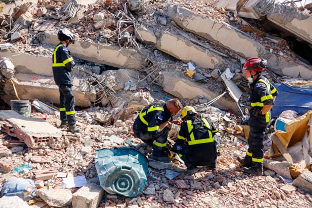 Members of Caracas firefighters search for victims amid debris of a demolished building after a magnitude 7.2 earthquake struck Venezuela and other regions in the Caribbean in La Guaira, Venezuela, on June 27, 2026. According to the U.S. Geological Survey, a powerful 7.5?magnitude aftershock struck after the main quake. Medical and media sources reported that the death toll has risen to around 1,500, with some 3,000 others injured. A web page created to track the missing has listed nearly 50,000 people as unaccounted for. photo by Jonathan Lanza  VAN2026062804 JonathanxLanza