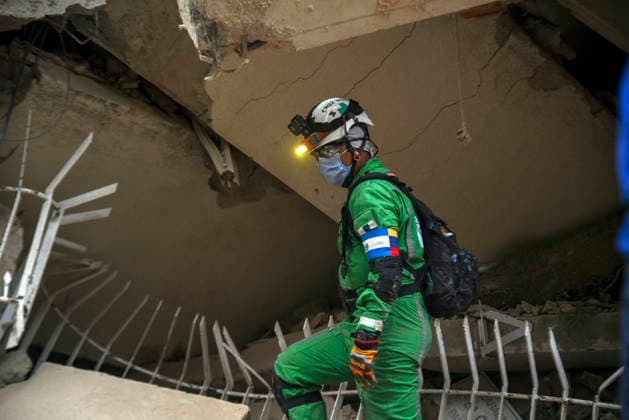 Members of Caracas firefighters search for victims amid debris of a demolished building after a magnitude 7.2 earthquake struck Venezuela and other regions in the Caribbean in La Guaira, Venezuela, on June 27, 2026. According to the U.S. Geological Survey, a powerful 7.5?magnitude aftershock struck after the main quake. Medical and media sources reported that the death toll has risen to around 1,500, with some 3,000 others injured. A web page created to track the missing has listed nearly 50,000 people as unaccounted for. photo by Jonathan Lanza  VAN2026062808 JonathanxLanza