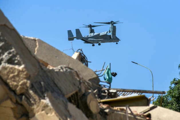 A drone searches for survivors as rescue teams continue looking for victims amid debris of a demolished building after a magnitude 7.2 earthquake struck Venezuela and other regions in the Caribbean in La Guaira, Venezuela, on June 27, 2026. According to the U.S. Geological Survey, a powerful 7.5?magnitude aftershock struck after the main quake. Medical and media sources reported that the death toll has risen to around 1,500, with some 3,000 others injured. A web page created to track the missing has listed nearly 50,000 people as unaccounted for. photo by Jonathan Lanza  VAN2026062809 JonathanxLanza