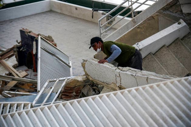 A Venezuelan man inspects his destroyed home as rescue teams continue searching for victims amid debris of a demolished building after a magnitude 7.2 earthquake struck Venezuela and other regions in the Caribbean in La Guaira, Venezuela, on June 27, 2026. According to the U.S. Geological Survey, a powerful 7.5?magnitude aftershock struck after the main quake. Medical and media sources reported that the death toll has risen to around 1,500, with some 3,000 others injured. A web page created to track the missing has listed nearly 50,000 people as unaccounted for.  VAN2026062824 JonathanxLanza