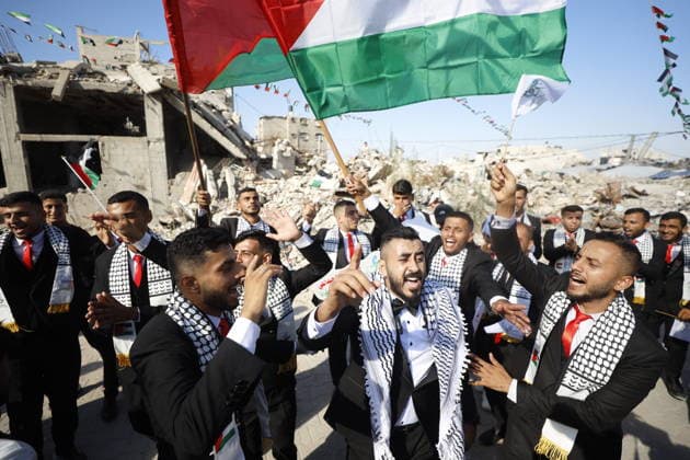 150 Palestinian couples tie the knot in mass wedding at Jabalia Camp GAZA, PALESTINE - JUNE 28: Newlyweds celebrate as 150 Palestinian couples tie the knot in a mass wedding ceremony organized by a charity organization at the Jabalia Refugee Camp in the northern Gaza Strip, Gaza, Palestine on June 28, 2026. The young couples advanced towards the wedding hall accompanied by traditional songs and dances. Ahmed Jihad Ibrahim Al-arini Anadolu Gaza City Gaza. Editorial use only. Please get in touch for any other usage.  Copyright: x2026xAnadoluxAhmedxJihadxIbrahimxAl-arinix