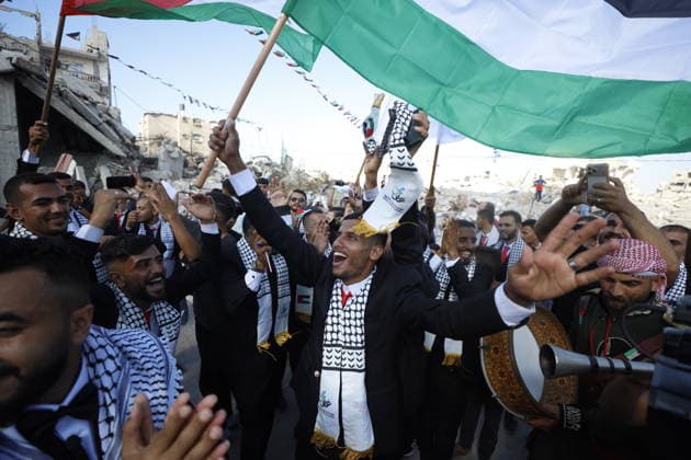 150 Palestinian couples tie the knot in mass wedding at Jabalia Camp GAZA, PALESTINE - JUNE 28: Newlyweds celebrate as 150 Palestinian couples tie the knot in a mass wedding ceremony organized by a charity organization at the Jabalia Refugee Camp in the northern Gaza Strip, Gaza, Palestine on June 28, 2026. The young couples advanced towards the wedding hall accompanied by traditional songs and dances. Ahmed Jihad Ibrahim Al-arini Anadolu Gaza City Gaza. Editorial use only. Please get in touch for any other usage.  Copyright: x2026xAnadoluxAhmedxJihadxIbrahimxAl-arinix
