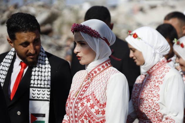 150 Palestinian couples tie the knot in mass wedding at Jabalia Camp GAZA, PALESTINE - JUNE 28: Newlyweds celebrate as 150 Palestinian couples tie the knot in a mass wedding ceremony organized by a charity organization at the Jabalia Refugee Camp in the northern Gaza Strip, Gaza, Palestine on June 28, 2026. The young couples advanced towards the wedding hall accompanied by traditional songs and dances. Ahmed Jihad Ibrahim Al-arini Anadolu Gaza City Gaza. Editorial use only. Please get in touch for any other usage.  Copyright: x2026xAnadoluxAhmedxJihadxIbrahimxAl-arinix