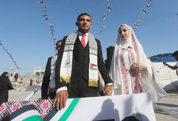 Mass Wedding Ceremony Brings Together 150 Couples in Northern Gaza Palestinian brides and grooms take part in a mass wedding ceremony in Jabalia, northern Gaza Strip, on June 28, 2026. The event was organized by the Ghouth Charitable Foundation as part of a social initiative to support the marriage of 150 couples from northern Gaza, months after the area suffered extensive destruction during the war. Photo by Bilal Osama apaimages Gaza city Gaza Strip Palestinian Territory 280626_Jabalia_BO_00(29) Copyright: xapaimagesxBilalxOsamax xapaimagesx