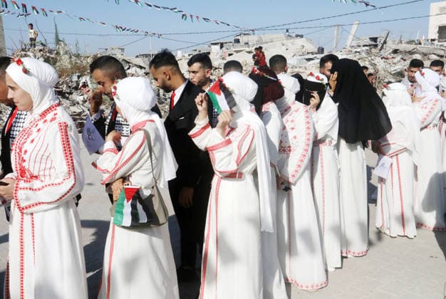 Mass Wedding Ceremony Brings Together 150 Couples in Northern Gaza Palestinian brides and grooms take part in a mass wedding ceremony in Jabalia, northern Gaza Strip, on June 28, 2026. The event was organized by the Ghouth Charitable Foundation as part of a social initiative to support the marriage of 150 couples from northern Gaza, months after the area suffered extensive destruction during the war. Photo by Bilal Osama apaimages Gaza city Gaza Strip Palestinian Territory 280626_Jabalia_BO_00(30) Copyright: xapaimagesxBilalxOsamax xapaimagesx