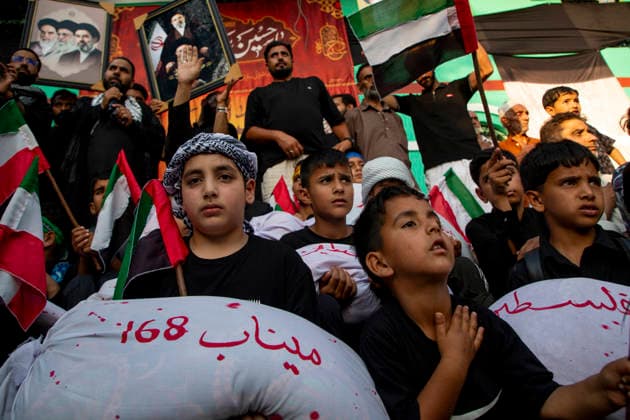 June 28, 2026, Srinagar, Jammu And Kashmir, India: Shiite Muslim children carry shrouded replicas symbolizing the children killed in the Israeli and US strikes on Minab School in Iran during a religious procession on the 12th day of the Islamic month of Muharram, expressing solidarity with the victims, in the outskirts of Srinagar, Indian administered Kashmir. Muharram, the first month of the Islamic calendar, is observed by Shiite Muslims around the world in remembrance of Imam Hussain, the grandson of the Prophet Muhammad, who was killed along with members of his family and companions in the Battle of Karbala in present day Iraq in 680 AD. Srinagar India  - ZUMAs197 20260628_aaa_s197_052 Copyright: xFaisalxBashirx