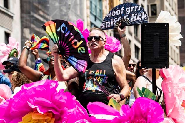 June 28, 2026, New York City, New York, United States: A person on a parade float with a hand fan with the word pride writtem on it at the New York City (NYC) Pride March on Fifth Avenue in New York City. New York City United States - ZUMAb161 20260628_aap_b161_002 Copyright: xMichaelxBrochsteinx