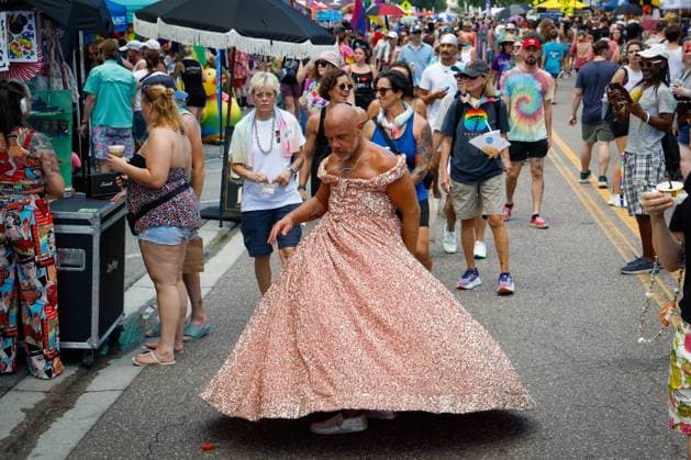 June 28, 2026, St. Petersburg, Florida, USA: Jay Webster, 42, of St. Petersburg, does a twirl in his dress, while takes in the festivities during the St. Pete Pride Grand Central Street Fair at the Grand Central District on Sunday, June 28, 2026, in St. Petersburg. St. Petersburg USA  - ZUMAs70_ 20260628_zan_s70_021 Copyright: xJeffereexWoox