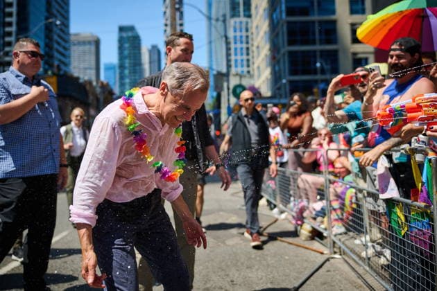 June 28, 2026, Toronto, On, Canada: Prime Minister Mark Carney is sprayed with water as he takes part in the Toronto Pride Parade on Sunday, June 28, 2026. Toronto Canada  - ZUMAc35_ 20260628_zaf_c35_041 Copyright: xSammyxKoganx