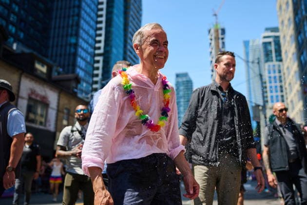 June 28, 2026, Toronto, On, Canada: Prime Minister Mark Carney is sprayed with water as he takes part in the Toronto Pride Parade on Sunday, June 28, 2026. Toronto Canada  - ZUMAc35_ 20260628_zaf_c35_042 Copyright: xSammyxKoganx
