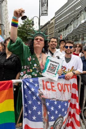 June 28, 2026, New York, New York, USA: An onlooker dressed as the Statue of Liberty has an American flag that reads ICE OUT as the 57th annual NYC Pride March proceeds down Fifth Avenue from Midtown to Greenwich Village. The theme For All of Us honors the legacy of activist Marsha P. Johnson. New York USA - ZUMAr174 20260628_znp_r174_042 Copyright: xGinaxMxRandazzox
