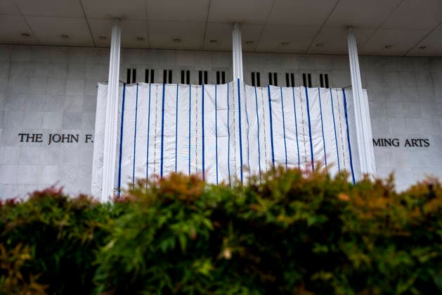 Scaffolding and tarp covers the building name of the John F. Kennedy Center for the Performing Arts, on Monday, June 15, 2026 in Washington, DC. Early June, a judge ordered the removal of US President Donald Trump s name from the facade of the building.  WAP20260628302 BONNIExCASH