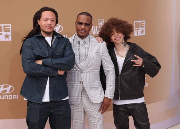 (L-R) Domani Harris, T.I. and KING arrive on the red carpet for 26th annual BET Awards live telecast at the Peacock Theater in Los Angeles on Sunday, June 28, 2026. The BET Awards honors Black entertainers and other people of color in music, film, sports and philanthropy.  LAP20260628305 GREGxGRUDT