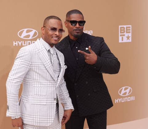 (L-R) T.I. and Jamie Foxx arrive on the red carpet for 26th annual BET Awards live telecast at the Peacock Theater in Los Angeles on Sunday, June 28, 2026. The BET Awards honors Black entertainers and other people of color in music, film, sports and philanthropy.  LAP20260628306 GREGxGRUDT