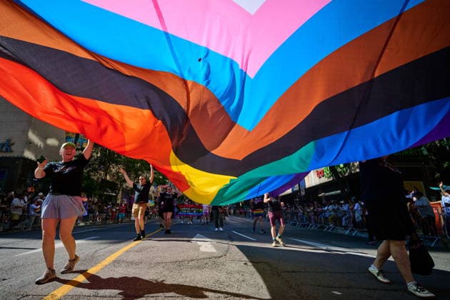 June 28, 2026, Toronto, On, Canada: People carry a rainbow flag as they take part in the Toronto Pride Parade on Sunday, June 28, 2026. Toronto Canada  - ZUMAc35_ 20260628_zaf_c35_143 Copyright: xSammyxKoganx