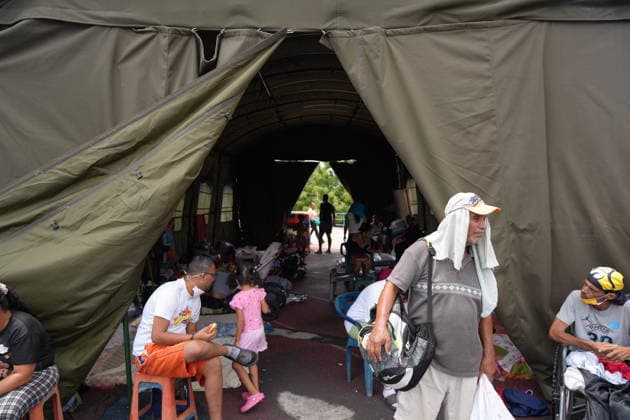 (260629) -- LA GUAIRA, June 29, 2026 -- People affected by earthquakes rest in a tent at a sports center in La Guaira, Venezuela, June 28, 2026. Venezuelan National Assembly President Jorge Rodriguez said Sunday that the death toll from two powerful earthquakes that uck Venezuela Wednesday has risen to 1,450. ( Xinhua) (SpotNews) VENEZUELA-LA GUAIRA-EARTHQUAKE-AFTERMATH STR 