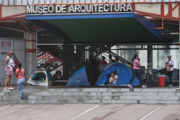 (260629) -- CARACAS, June 29, 2026 -- People affected by earthquakes rest in their tents in front of the Architecture Museum in Caracas, Venezuela, June 28, 2026. Venezuelan National Assembly President Jorge Rodriguez said Sunday that the death toll from two powerful earthquakes that struck Venezuela Wednesday has risen to 1,450. (Photo by Xinhua) (SpotNews) VENEZUELA-CARACAS-EARTHQUAKE-AFTERMATH MarcosxSalgado 