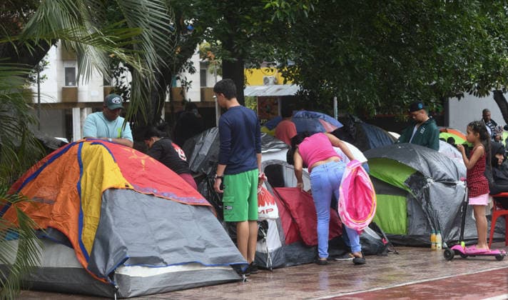 (260629) -- CARACAS, June 29, 2026 -- People affected by earthquakes rest near their tents in a square in Caracas, Venezuela, June 28, 2026. Venezuelan National Assembly President Jorge Rodriguez said Sunday that the death toll from two powerful earthquakes that struck Venezuela Wednesday has risen to 1,450. (Photo by Xinhua) (SpotNews) VENEZUELA-CARACAS-EARTHQUAKE-AFTERMATH MarcosxSalgado 