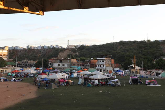 (260629) -- LA GUAIRA, June 29, 2026 -- Tents are seen on a baseball field in Catia La Mar, La Guaira state, Venezuela, June 28, 2026. Venezuelan National Assembly President Jorge Rodriguez said Sunday that the death toll from two powerful earthquakes that uck Venezuela Wednesday has risen to 1,450. ( Xinhua) (SpotNews) VENEZUELA-LA GUAIRA-EARTHQUAKES-DEATH TOLL STR 