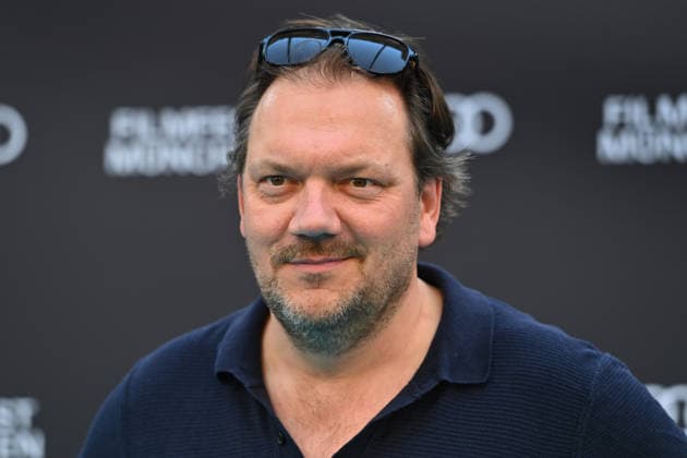 Charly HUEBNER (Schauspieler), Einzelbild,angeschnittenes Einzelmotiv,Portraet,Portrait,Porträt. 43.Filmfest Muenchen Premiere SPAZIERGANG NACH SYRAKUS am 28.06.2026 Deutsches Theater. *** Charly HUEBNER, actor; still, cropped single image, portrait; 43rd Munich Film Festival premiere of *A Walk to Syracuse* on June 28, 2026, at the Deutsches Theater