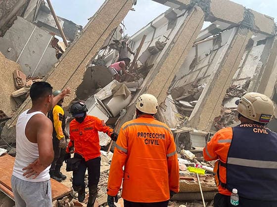 Search and rescue teams continue efforts to locate survivors trapped beneath the rubble of collapsed residential buildings in affected areas following the powerful 7.2‘magnitude earthquake that struck Venezuela and parts of the Caribbean on June 29, 2026. The death toll has risen to over 1,400, with more than 3,000 injured, while authorities report that over 70,000 people remain missing.  VAN2026062906 GovernmentxMinistryxofxInformati