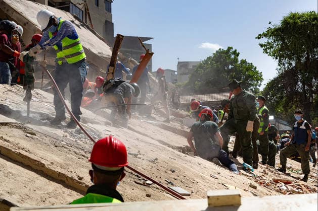 Search and rescue teams continue efforts to locate survivors trapped beneath the rubble of collapsed residential buildings in affected areas following the powerful 7.2‘magnitude earthquake that struck Venezuela and parts of the Caribbean on June 29, 2026. The death toll has risen to over 1,400, with more than 3,000 injured, while authorities report that over 70,000 people remain missing.  VAN2026062918 GovernmentxMinistryxofxInformati