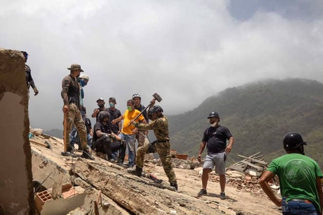 Search and rescue teams continue efforts to locate survivors trapped beneath the rubble of collapsed residential buildings in affected areas following the powerful 7.2‘magnitude earthquake that struck Venezuela and parts of the Caribbean on June 29, 2026. The death toll has risen to over 1,400, with more than 3,000 injured, while authorities report that over 70,000 people remain missing.  VAN2026062920 GovernmentxMinistryxofxInformati